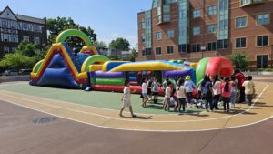 Colorful bounce house rental in Long Island backyard